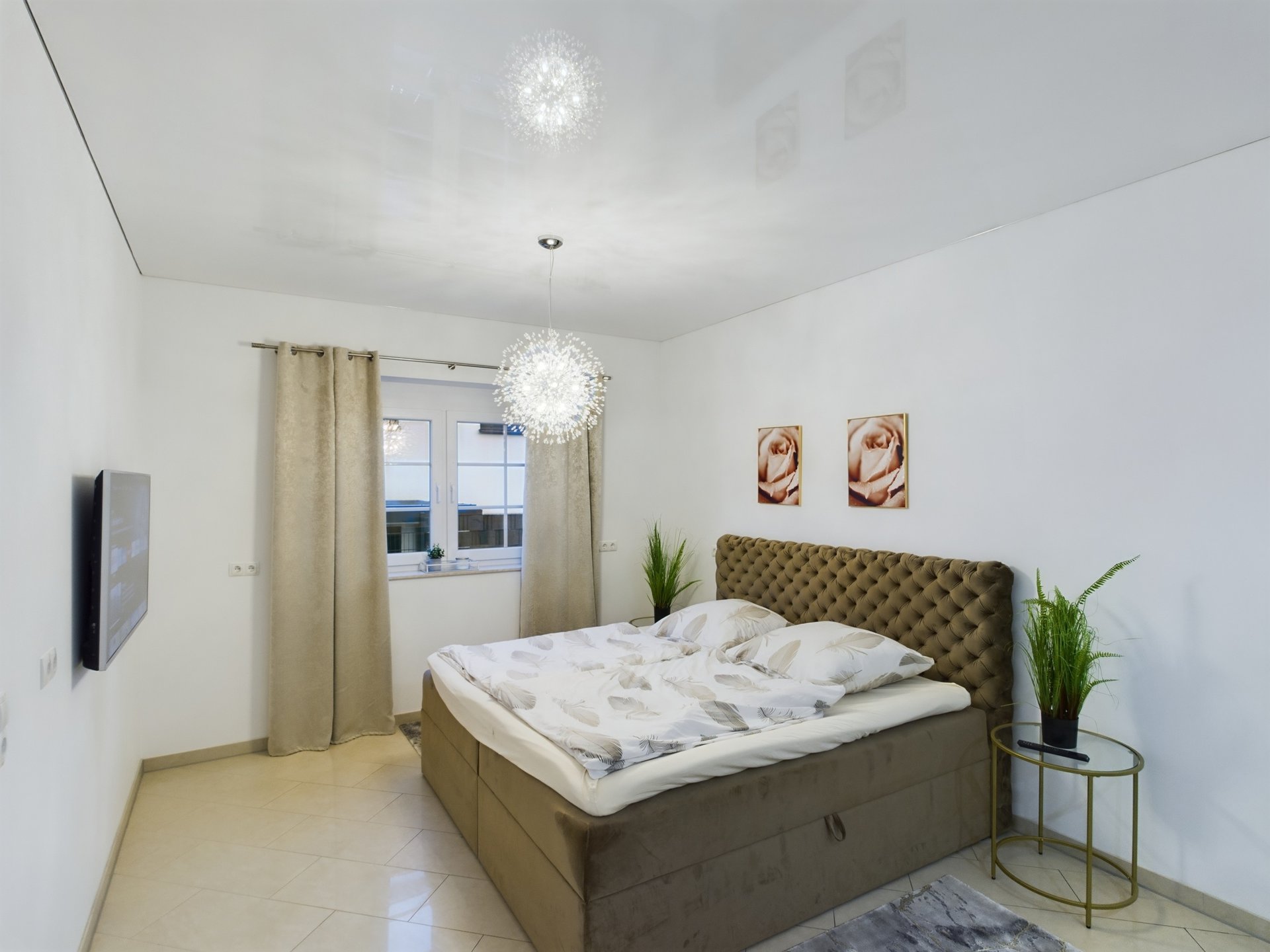 siegelbach-59a-23 A detailed image of a modern bedroom with a large bed, decorative wall art, and natural light from t.