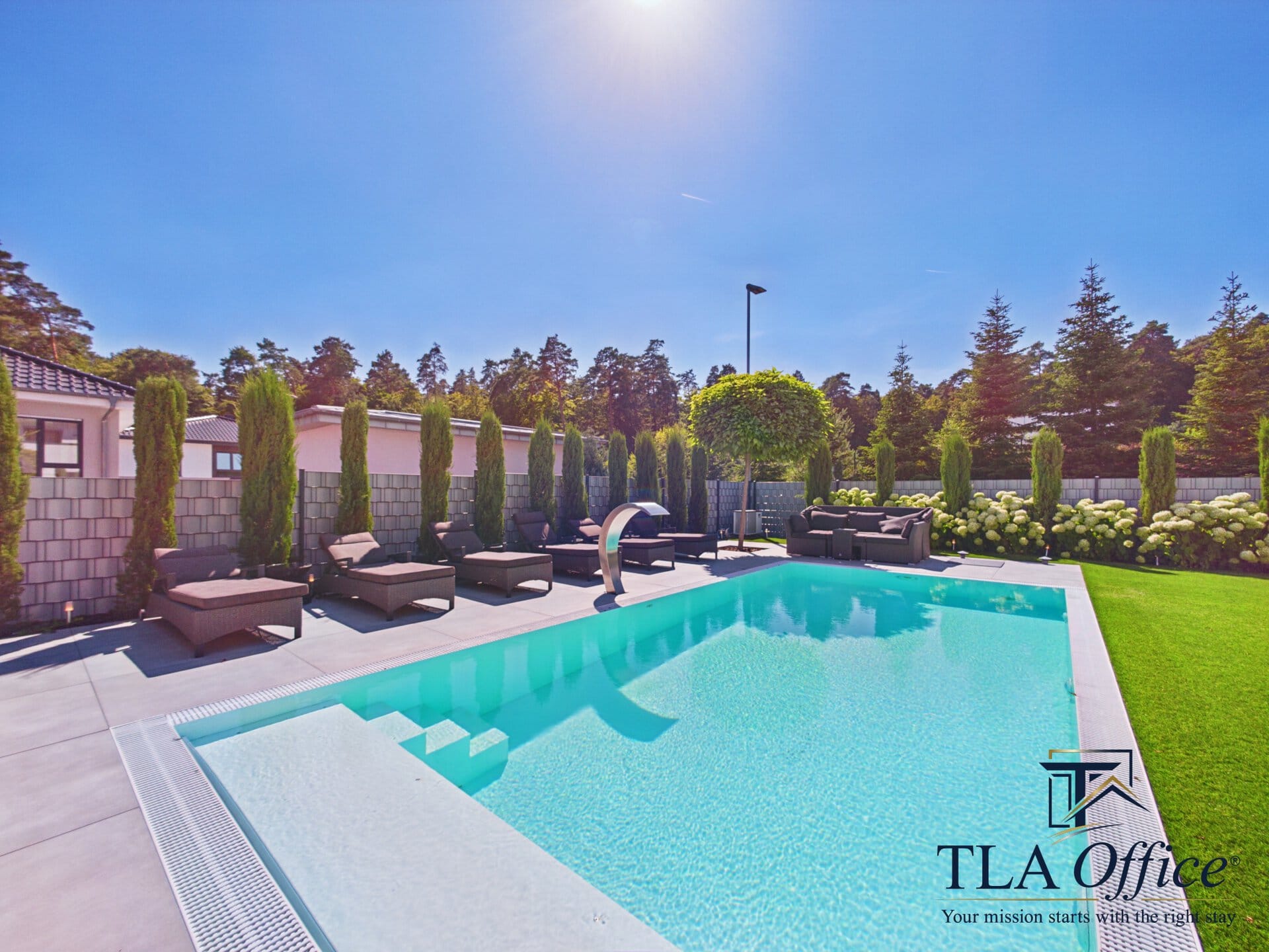 CAM01139G0-PR0080-STILL073 Swimming pool with lounge seating on a sunny day - Luxury TLA Residence Siegelbach