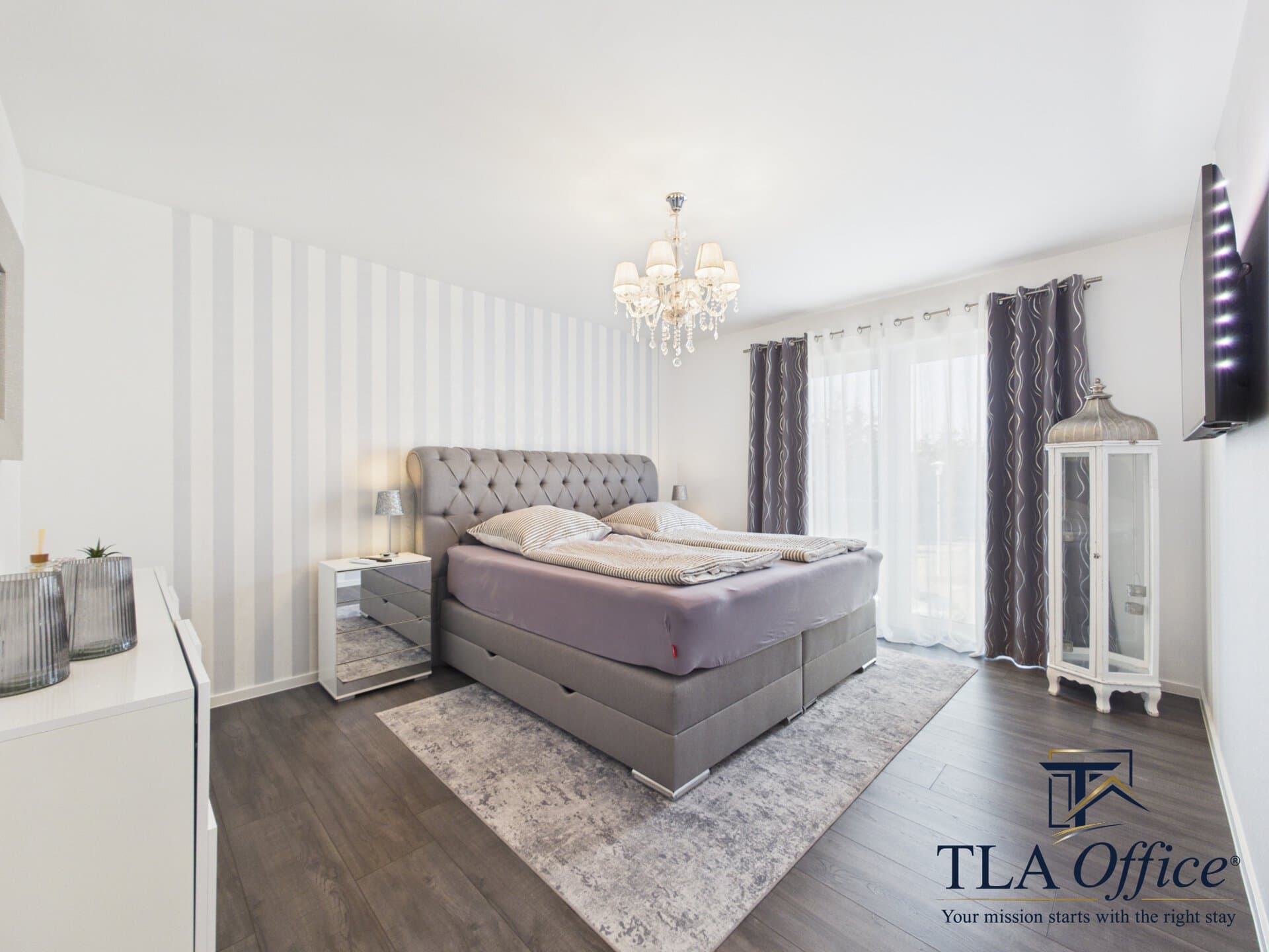 CAM01139G0-PR0080-STILL097 Elegant bedroom with striped wallpaper and chandelier - Luxury TLA Residence Siegelbach