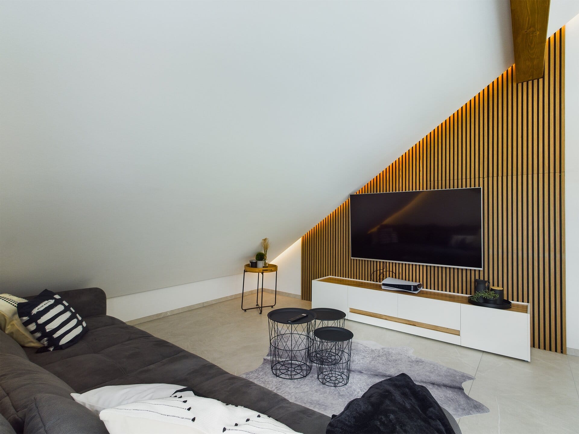 Modern living room with TV and stylish decor in a spacious 3-bedroom TLA apartment near Ramstein Air.